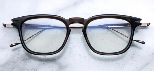 Silver 100% beta titanium temples and 4mm acetate front with clear lenses. Limited production batch of 450 pieces. Handcrafted in Japan. Size 50/21.