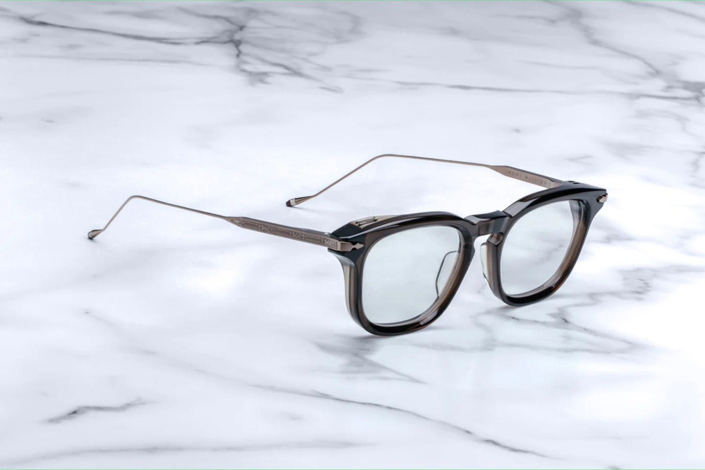 Silver 100% beta titanium temples and 4mm acetate front with clear lenses. Limited production batch of 450 pieces. Handcrafted in Japan. Size 50/21.