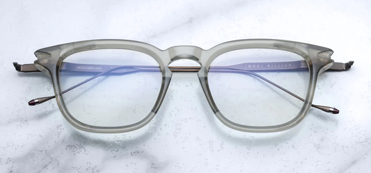 Silver 100% beta titanium temples and 4mm acetate front with clear lenses. Limited production batch of 350 pieces.Handcrafted in Japan.Size 50/21.