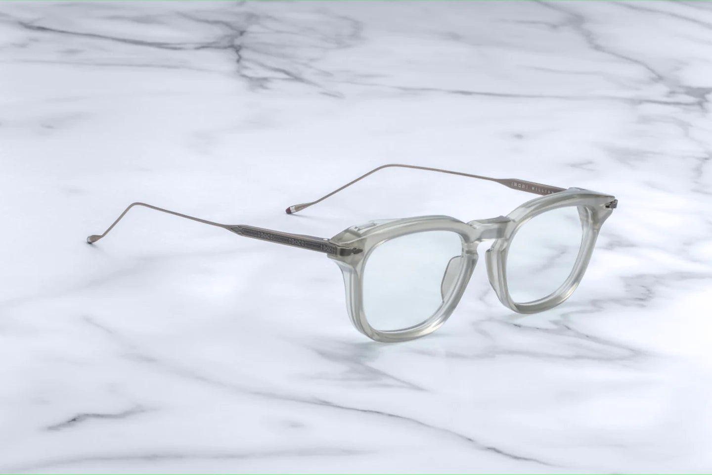 Silver 100% beta titanium temples and 4mm acetate front with clear lenses. Limited production batch of 350 pieces.Handcrafted in Japan.Size 50/21.