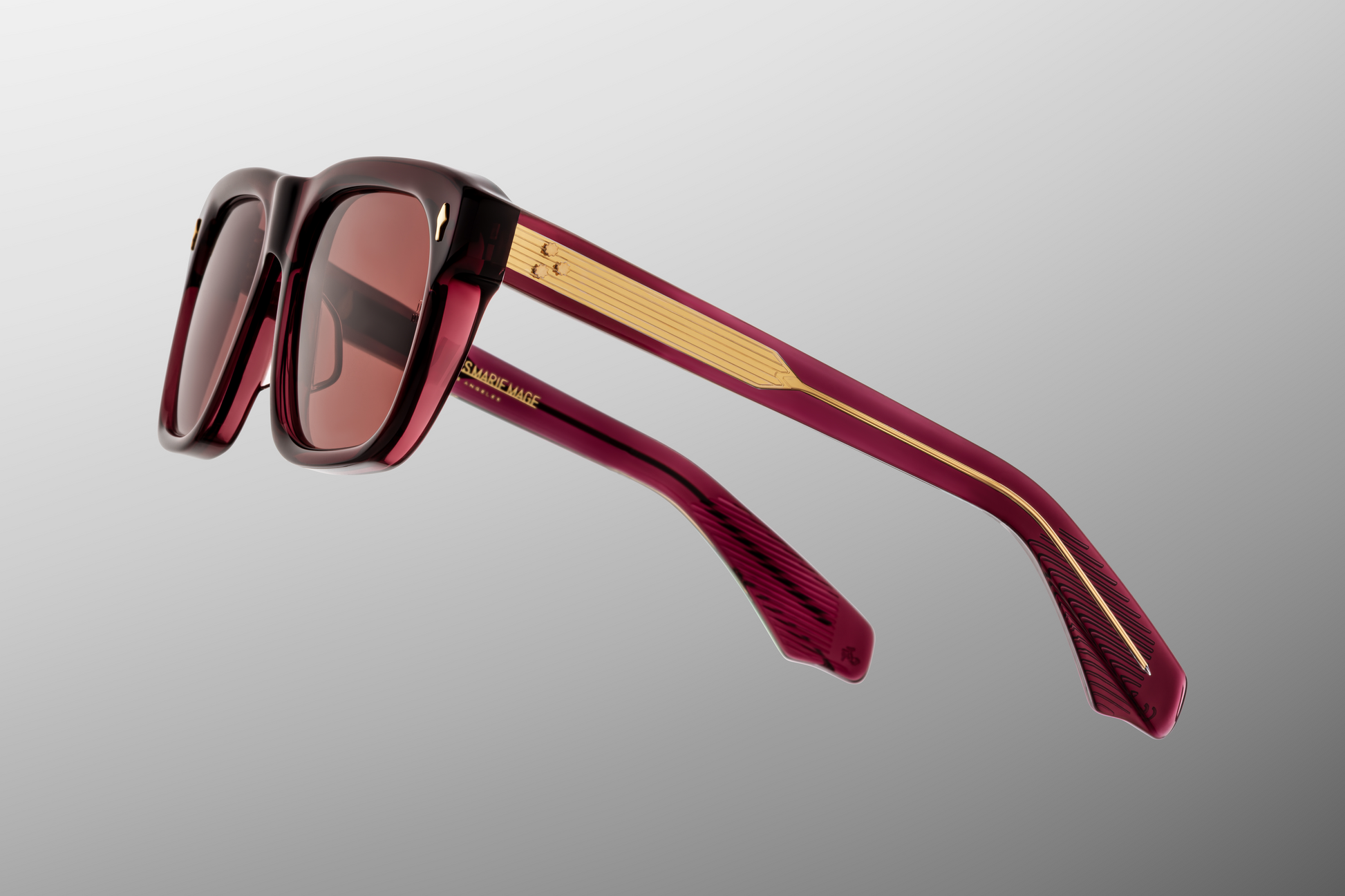 Three-quarter view of Yves Amarena — showing thick 10 mm red acetate, gentle tapering toward the temples, and the bold shape of the frame