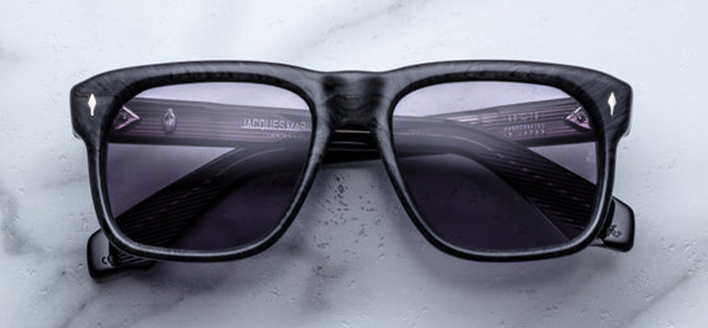 Front of JMM Yves Ebony sunglasses — wide rectangular charcoal burlwood frame with sterling-silver arrowhead pins at the hinges