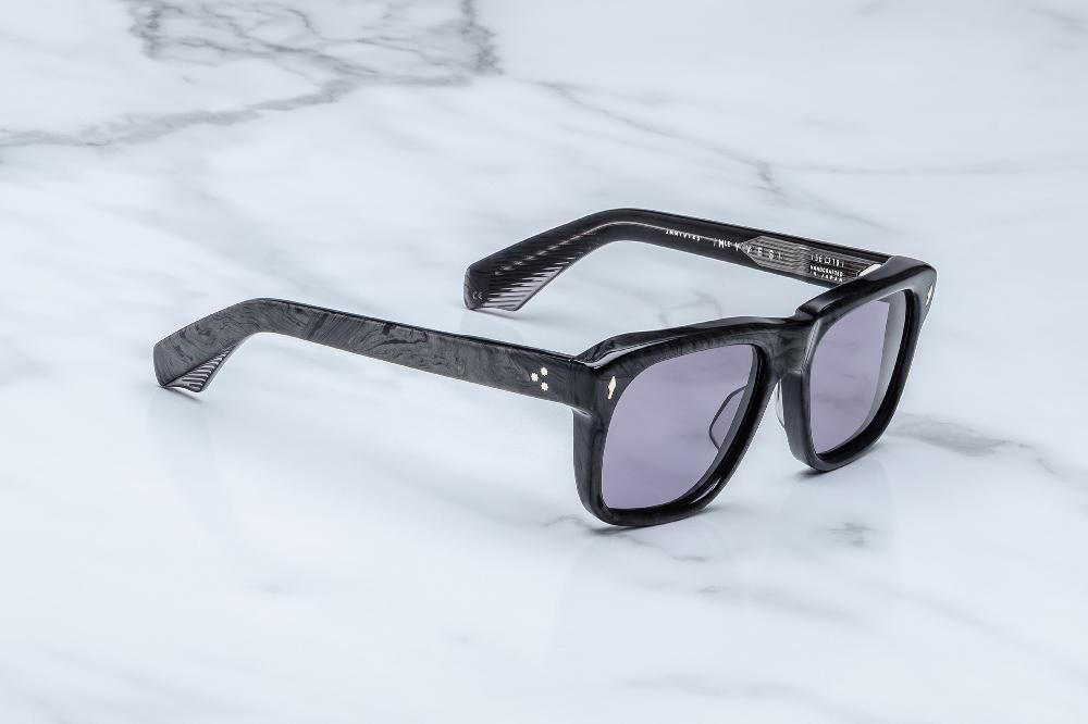 Side of the Yves Ebony — double-laminated charcoal burlwood temple showing crystal gray interior and exposed silver-palladium wirecore