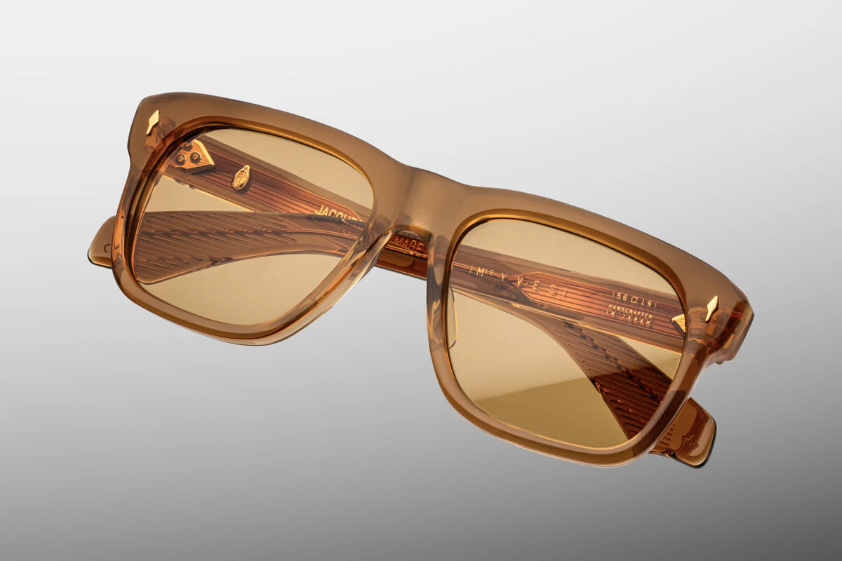 Top-down view of the Jacques Marie Mage Yves Solaris photochromic sunglasses, highlighting the imposing 10mm thickness of the front block acetate profile. From above, the clean alignment of the bold temples reveals the full length of the internal dark gold wire cores and the robust, multi-barrel hinge construction. Available at WINK Optometrists.