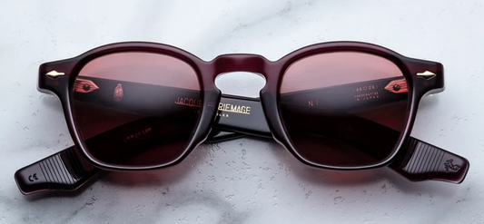 Front studio view of Jacques Marie Mage Zephirin sunglasses in Amarena, showcasing a square 1940s-style frame in polished deep cherry-red acetate with matching translucent red lenses and dark gold arrowhead pins