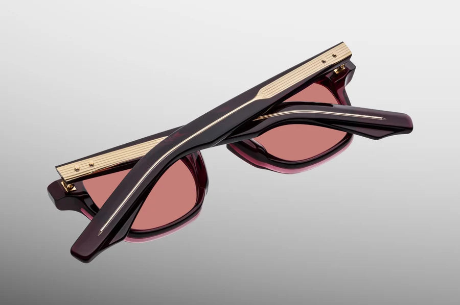 Rear perspective of the JMM Zephirin Bordeaux Empire temples, detailing the curved ear bends where the translucent deep burgundy-red acetate surrounds the internal gold-plated wirecore tips.
