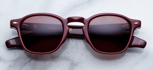  Front studio shot of Jacques Marie Mage Zephirin sunglasses in Bordeaux Empire, showcasing a vintage square shape in polished burgundy-red acetate with solid deep brown lenses and 18k dark gold arrowhead pins.