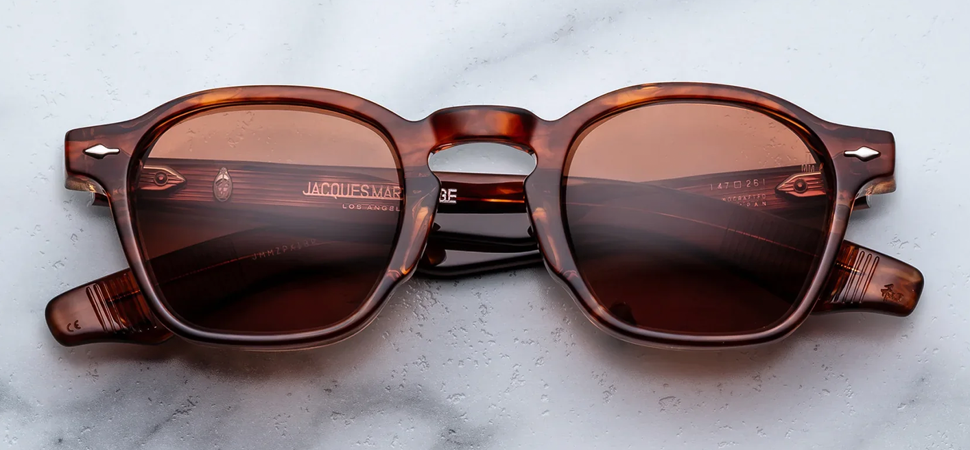Front studio shot of Jacques Marie Mage Zephirin sunglasses in Bourbon, showcasing a square 1940s-style frame in rich Havana tortoise shell acetate with dark brown lenses and sterling silver arrowhead front pins.