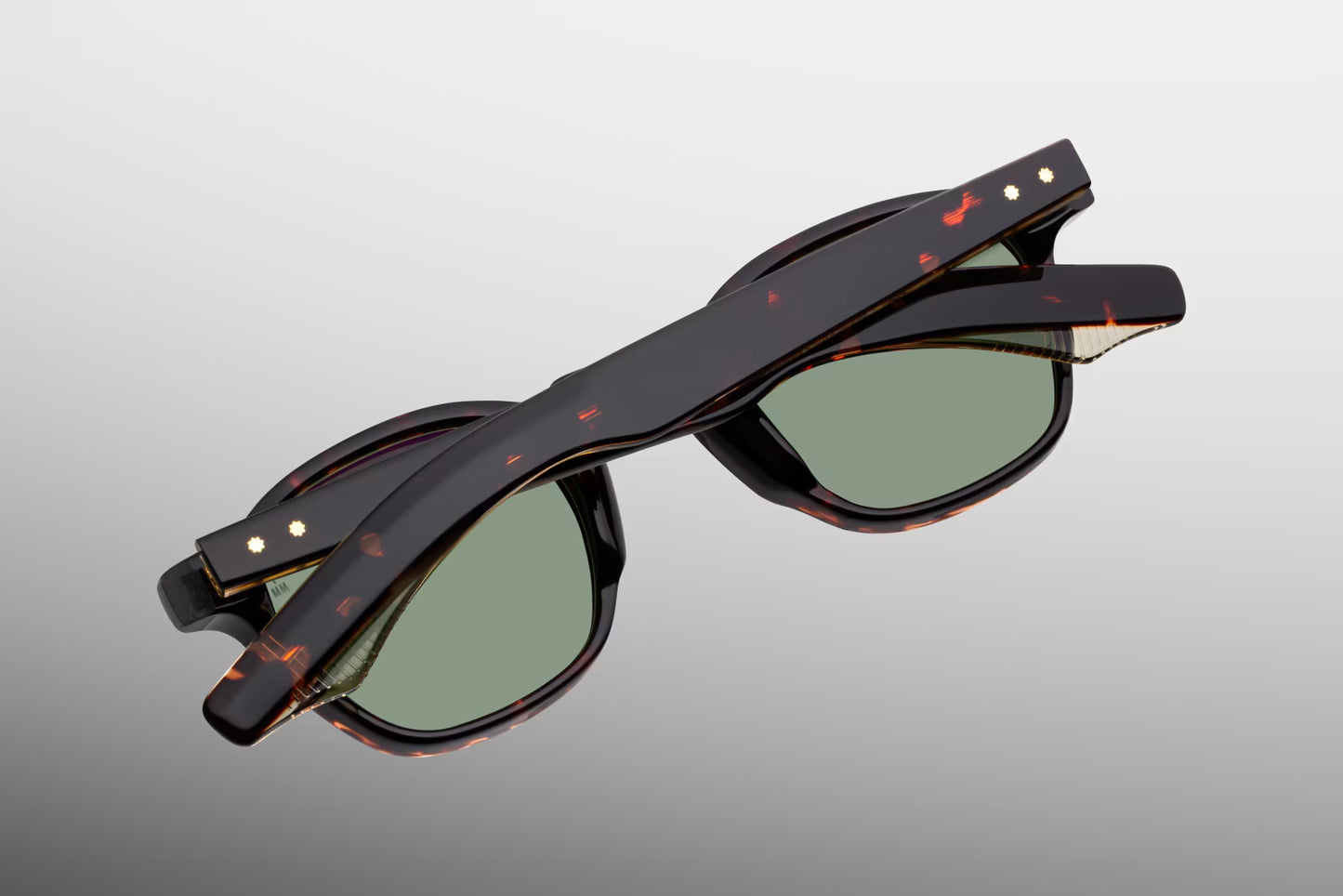 Rear perspective of the JMM Zephirin Etna temples, detailing the curved ear bends where the rich Havana tortoise shell exterior transitions to a crystal-clear inner laminate to showcase the internal gold-plated wirecore tips.