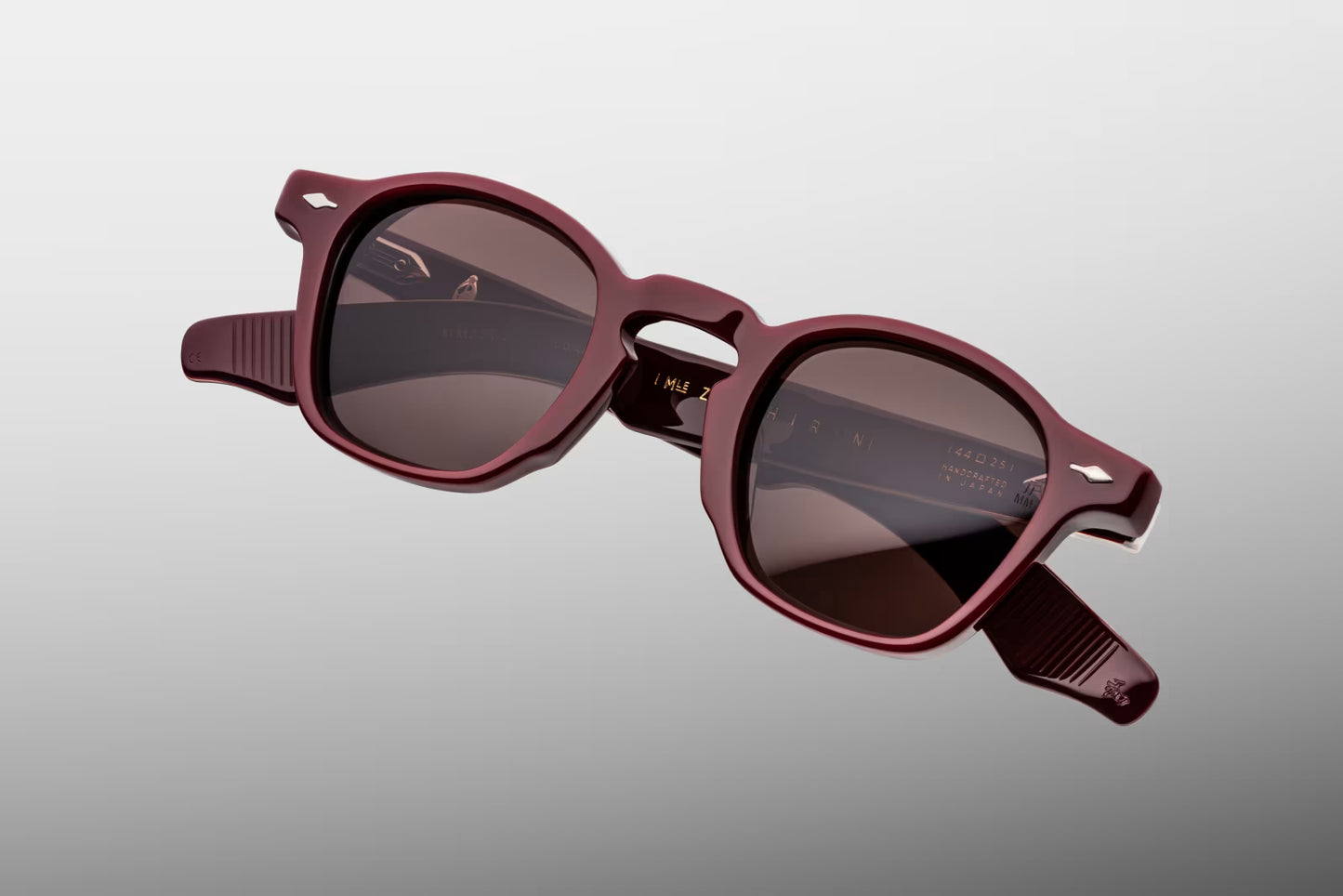 Close-up front view of Jacques Marie Mage Zephirin Bordeaux Empire sunglasses featuring the signature Zephirin shape, polished Bordeaux acetate and deep brown CR39 lenses
