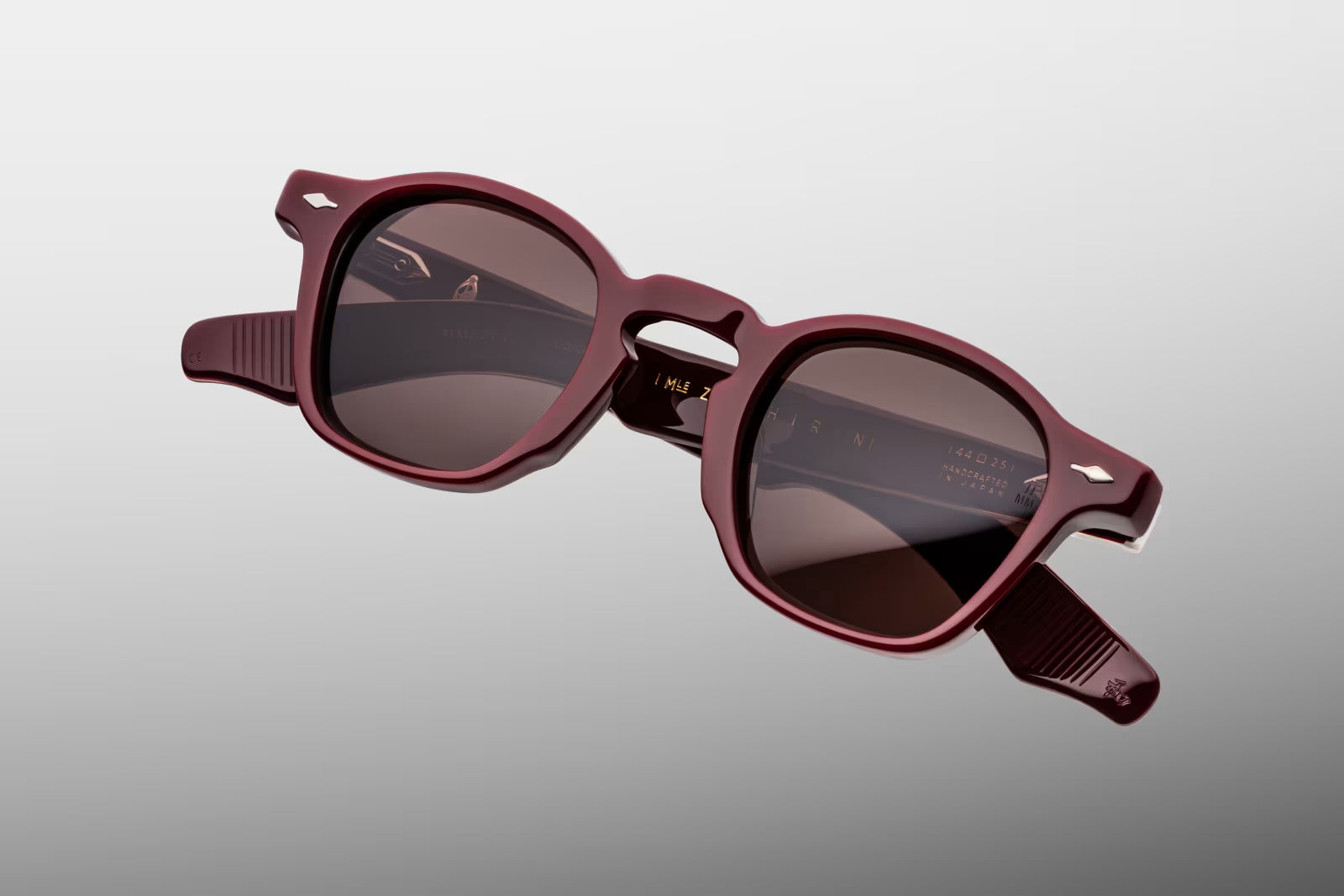 Close-up front view of Jacques Marie Mage Zephirin Bordeaux Empire sunglasses featuring the signature Zephirin shape, polished Bordeaux acetate and deep brown CR39 lenses