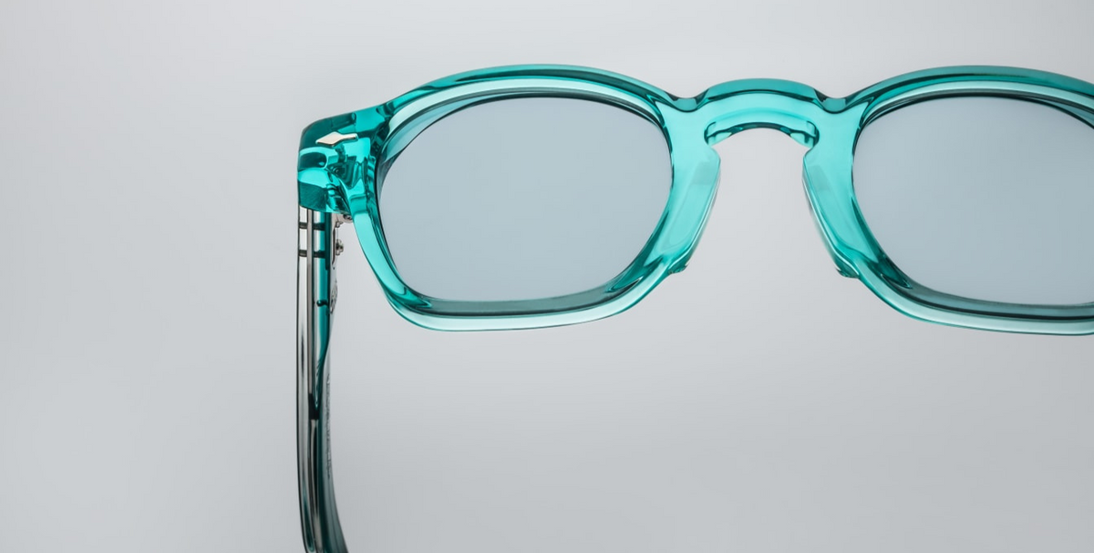 Close-up detail of Jacques Marie Mage Zephirin turquoise acetate frame with metal hardware accents