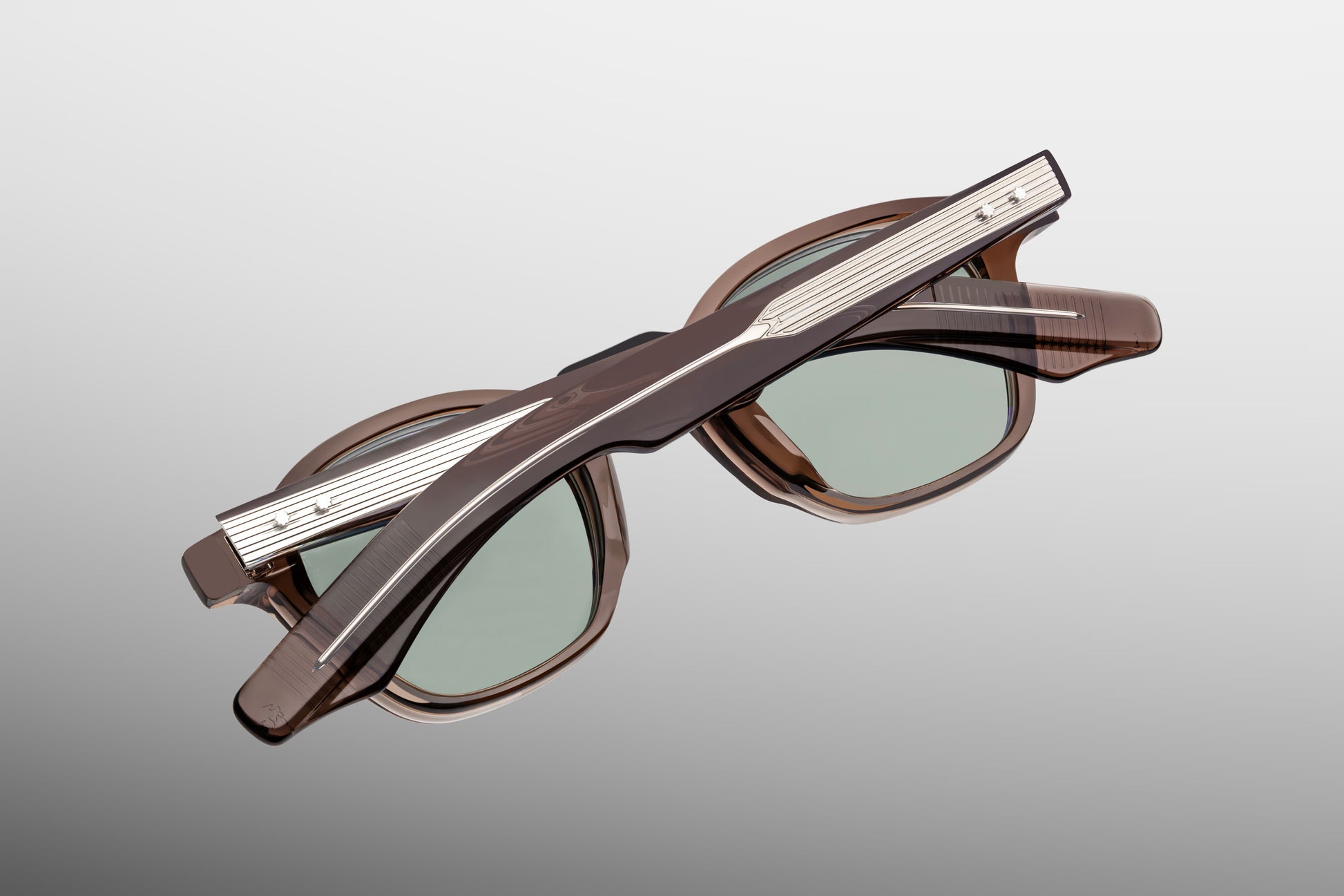 Back view of Jacques Marie Mage Zephirin Dusty Jade sunglasses displaying interior frame structure, signature temple engraving, and premium acetate detailing