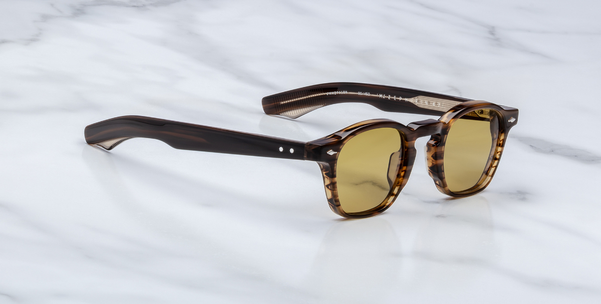 Side view of Zephirin Hazel by Jacques Marie Mage: layered Havana brown double‑laminated acetate temples, exposed inner silver wire‑core, sterling silver arrowhead front pin & precision tension‐secured 5‑barrel hinge with spur‑shaped rivets