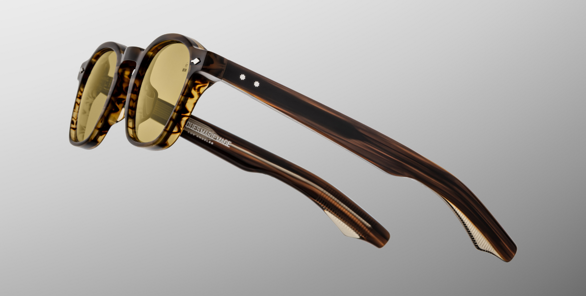 Side view of Zephirin Hazel by Jacques Marie Mage: layered Havana brown double‑laminated acetate temples, exposed inner silver wire‑core, sterling silver arrowhead front pin & precision tension‐secured 5‑barrel hinge with spur‑shaped rivets.