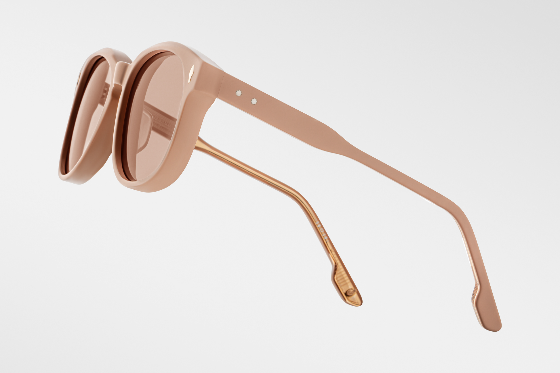 Side view of Jacques Marie Mage Kay dust suede sunglasses, highlighting matte pastel acetate temples and subtle gold hardware