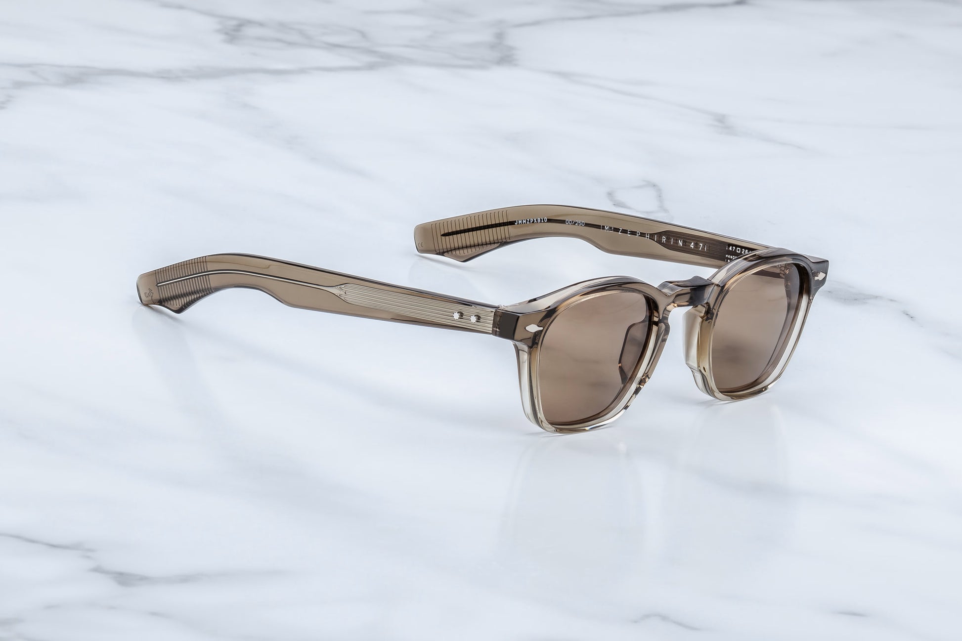 Jacques Marie Mage Zephirin Lescot side view showing sculpted acetate temples and exposed silver wire core detail
Side profile of JMM Zephirin Lescot sunglasses highlighting slim lines, temple engraving and premium hardware