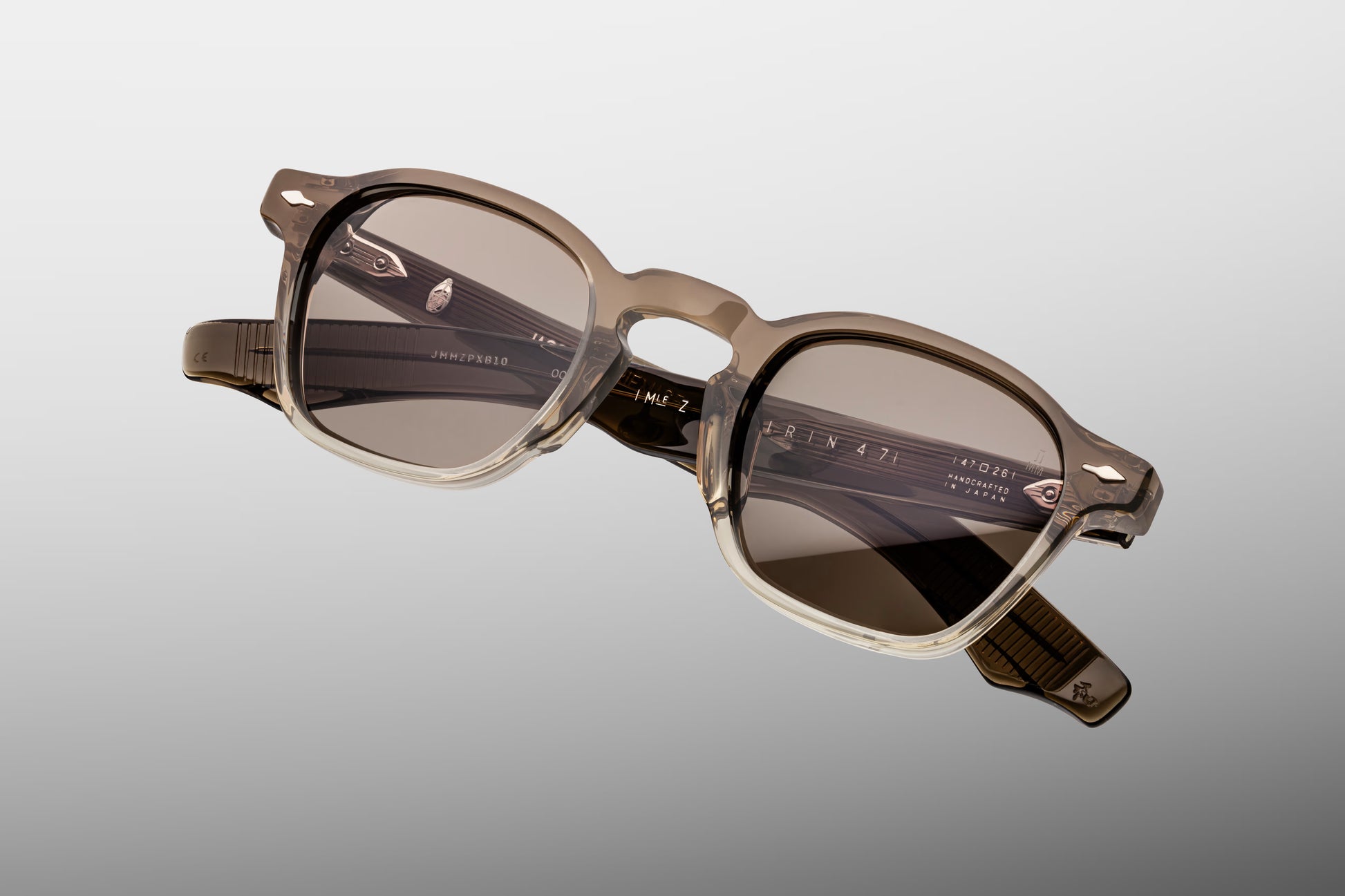 Close-up front detail of Jacques Marie Mage Zephirin Lescot frame showing signature arrowhead rivets and polished acetate
Macro front view of JMM Zephirin Lescot sunglasses highlighting rectangular lens shape and handcrafted finish