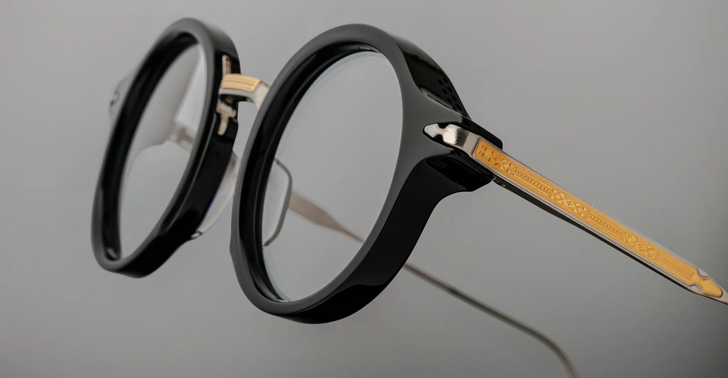 Side view of Jacques Marie Mage Norman optical frames in noir, highlighting sculpted acetate temples with integrated metal core and hinges and filigree metal temples