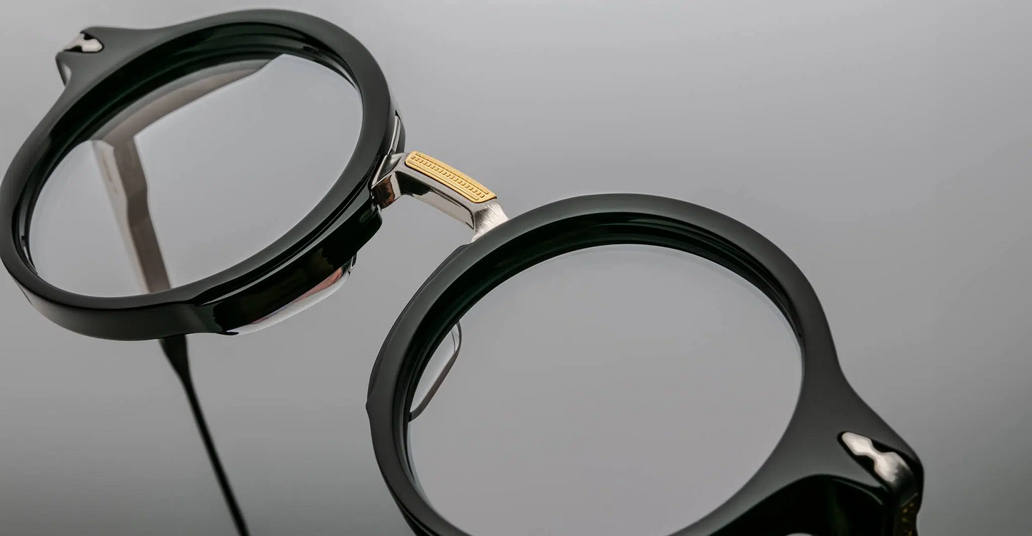 Top view of Jacques Marie Mage Norman noir frames, emphasizing acetate thickness and metal-engineered bridge and hinge alignment.