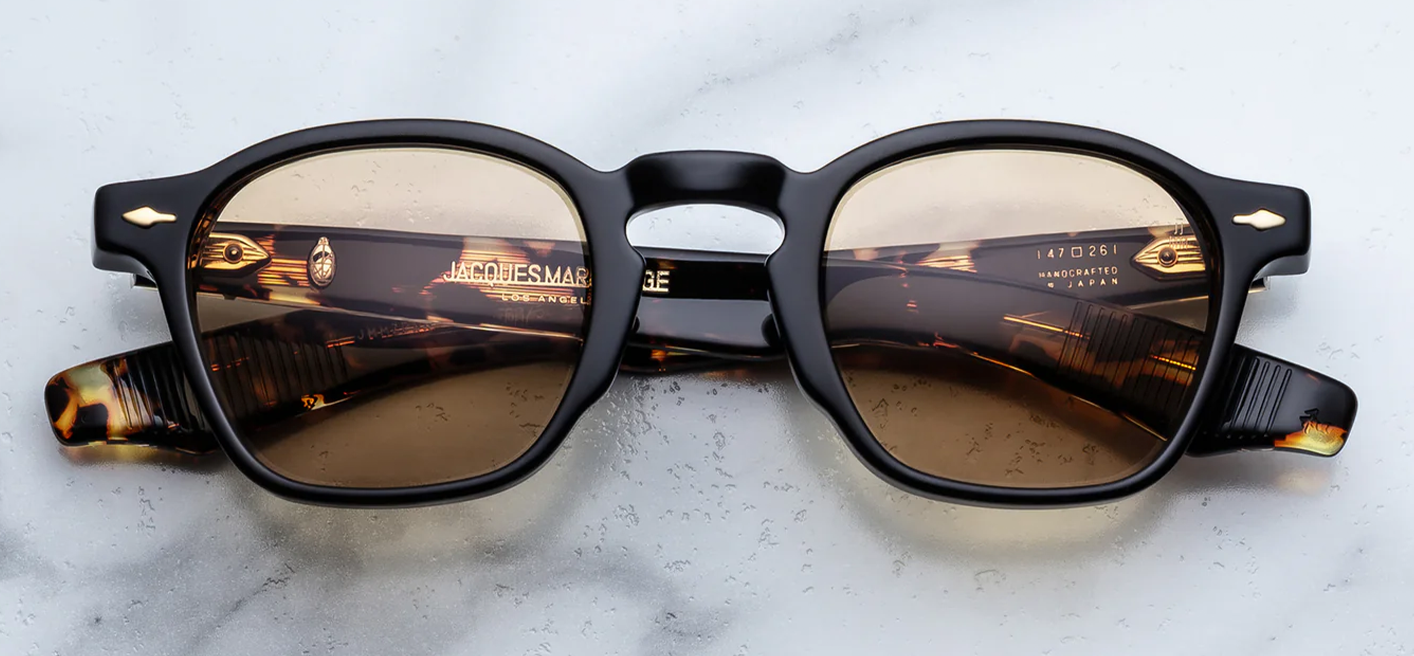 Jacques Marie Mage Zephirin Tavern sunglasses front view, rectangular black and tortoise acetate frame with brown lenses and gold arrowhead pins
Front view of JMM Zephirin Tavern frame, vintage-inspired rectangular sunglasses with warm brown lenses and premium acetate