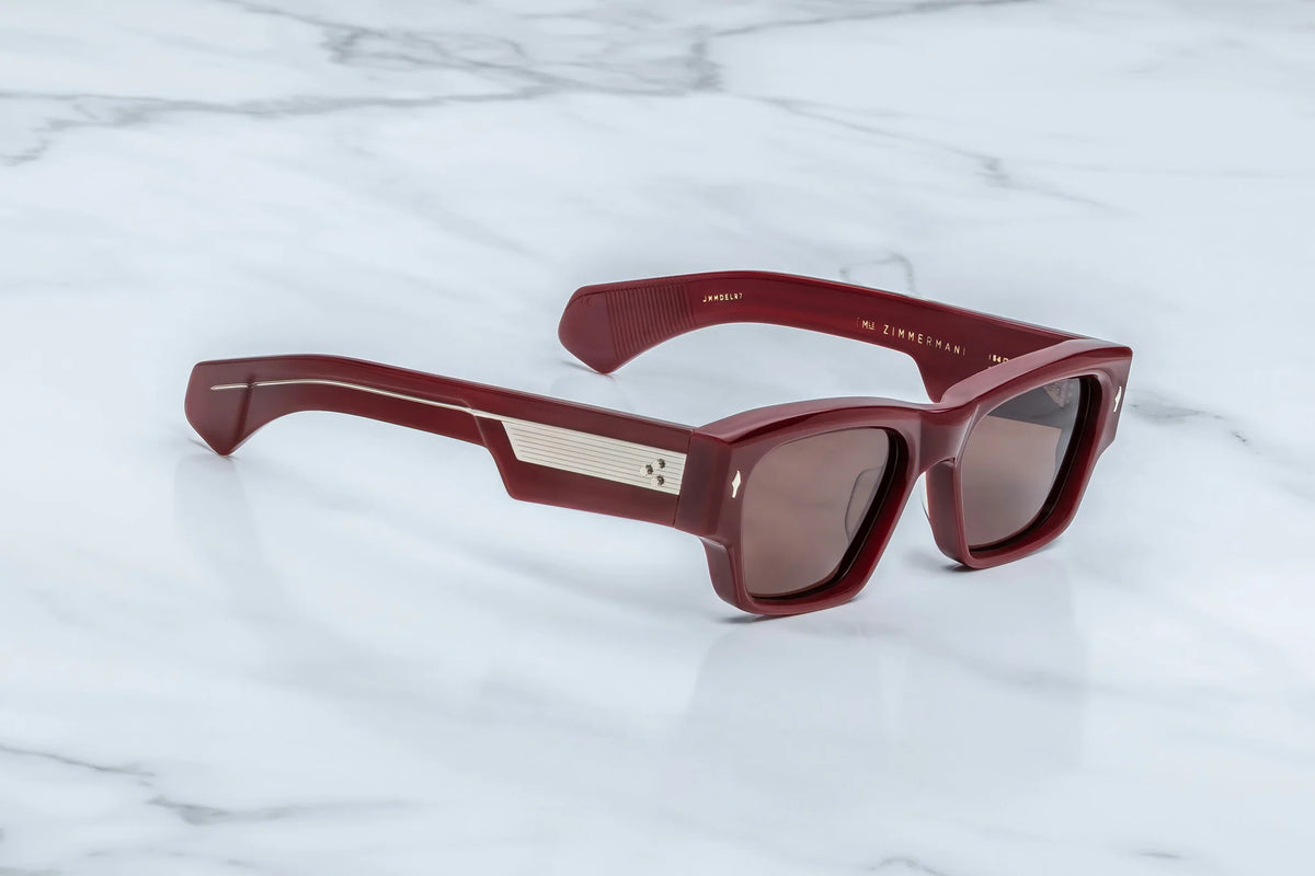 Side profile of JMM Zimmerman Bordeaux Empire frames showing dual clear and burgundy laminated temples.