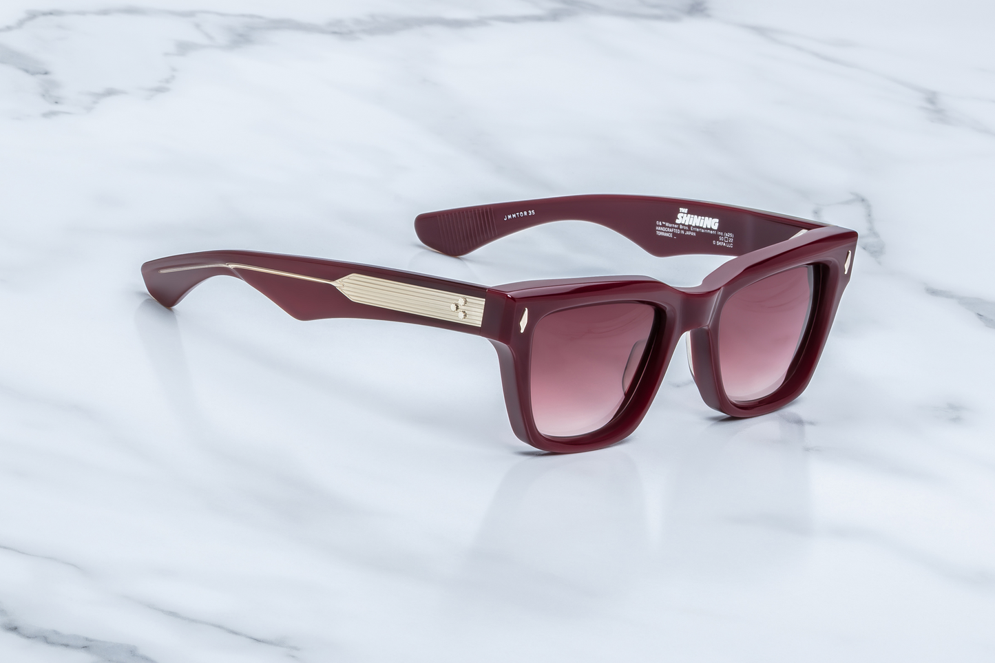 Side profile of Jacques Marie Mage Torrance Reserve collector sunglasses showing sculptural red acetate frame, custom double-laminated acetate temples and exposed silver-palladium wirecore — luxury eyewear available at WINK Optometrists Australia