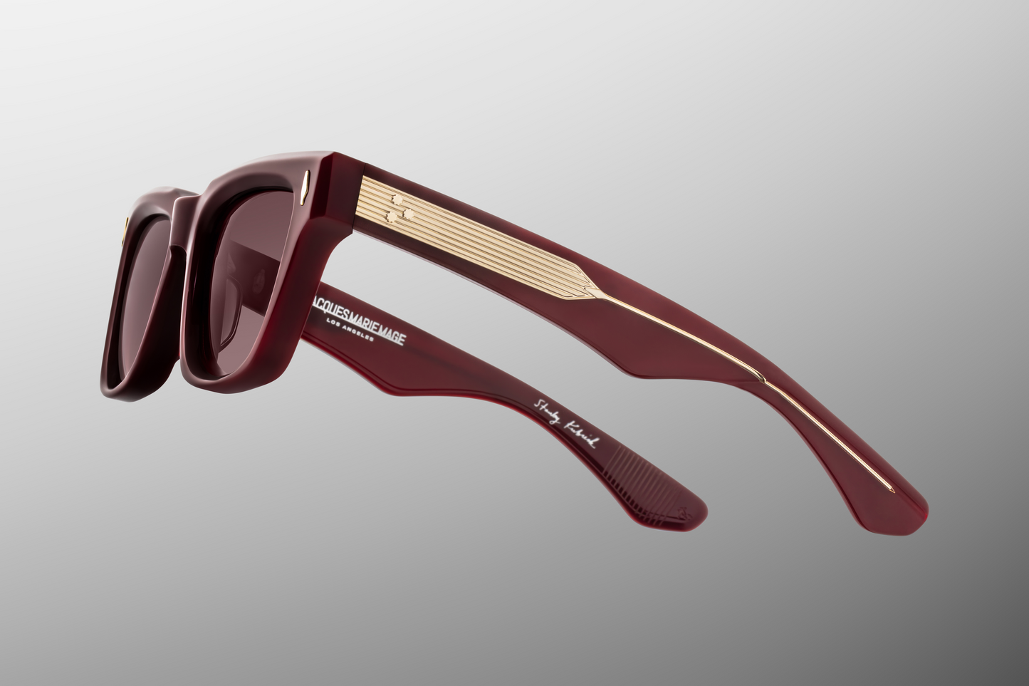 Close-up of side temple of Jacques Marie Mage Torrance Reserve collector sunglasses showing double-laminated acetate arms, custom silver-palladium plated hinges and engraved wirecore details — premium luxury eyewear