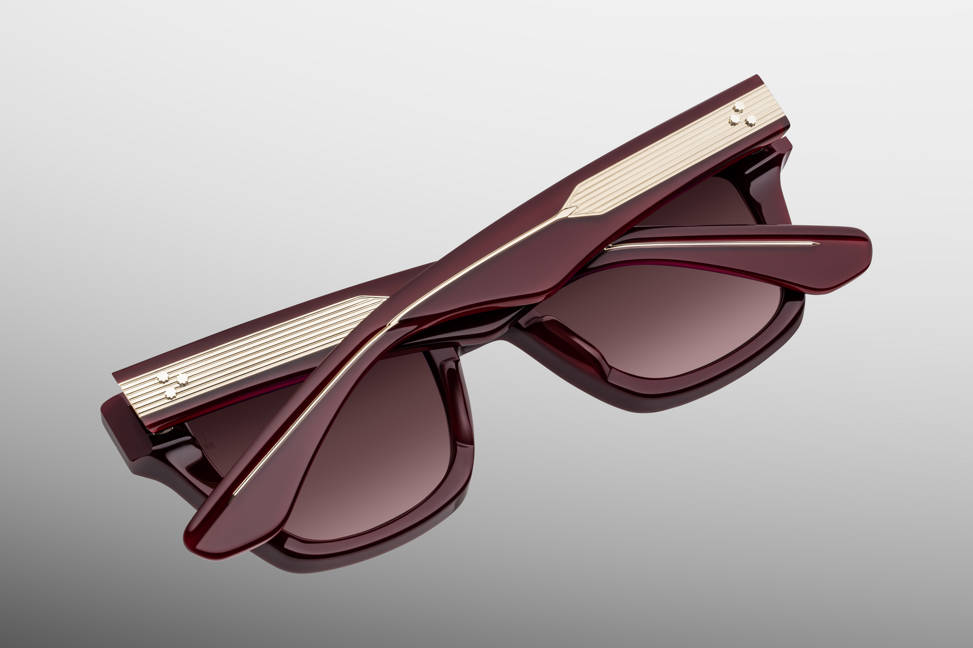 Back view of Jacques Marie Mage Torrance Reserve collector sunglasses with temples closed, showcasing polished red acetate finish, inner temple hallmarks and bold silhouette — limited-edition luxury eyewear