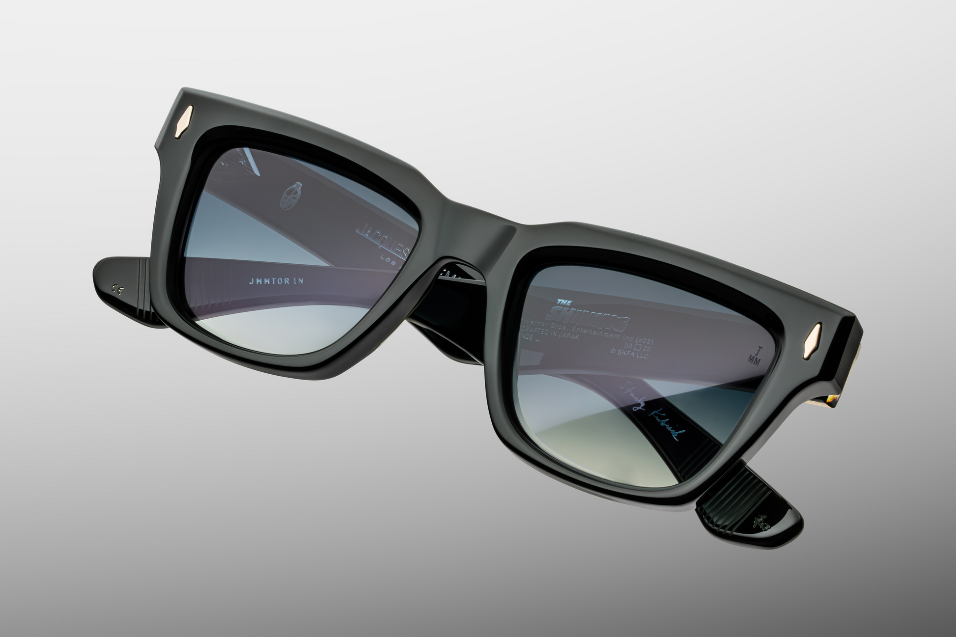 Front-facing close view of lenses of Jacques Marie Mage Torrance Viper limited-edition collector sunglasses with precision optics, handcrafted acetate and luxury hardware