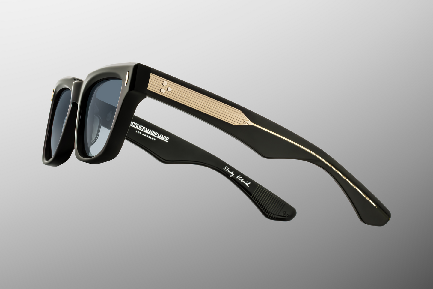 Close-up side temple detail of Jacques Marie Mage Torrance Viper collector sunglasses showing double-laminated acetate temples, engraved hairline details and precious metal accents — premium luxury eyewear available at WINK Optometrists Australia