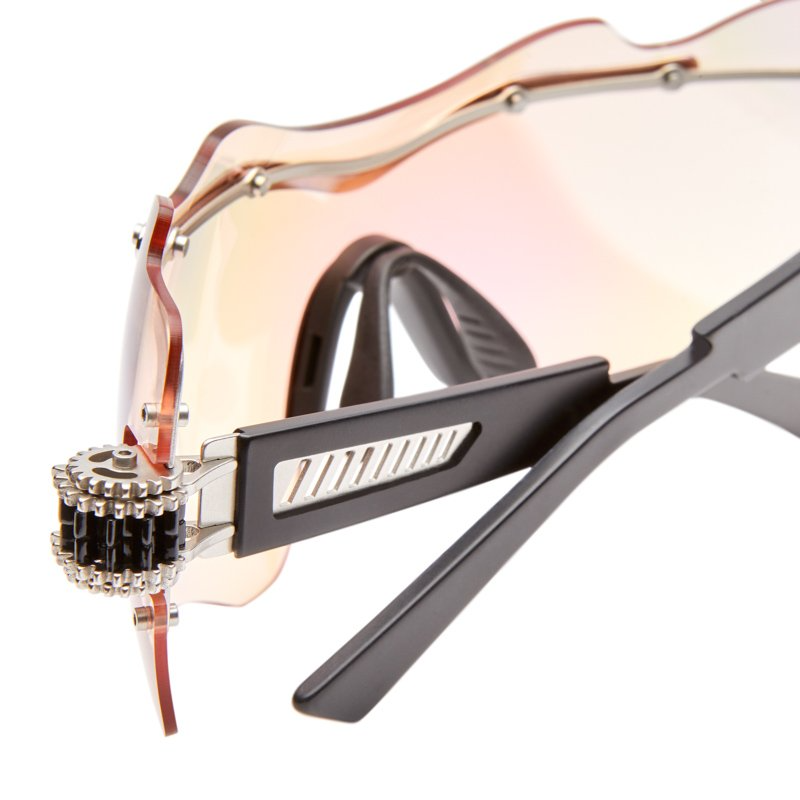 Close-up of the inner temple and  COGGED hinge of Kuboraum E16 SI Silver sunglasses — slim silver-metal arm and acetate temple tip visible