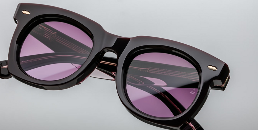 Sleek '50s inspired glasses with graceful lines, signature double-arrowhead front pins, and custom double-laminated temples with refined 'Lever' wire core. Purple 8mm cured cellulose acetate frame with custom double laminated acetate temples featuring precious metal hardware and primary purple gradient lenses. Light gold double-arrowhead front pin Inner light gold lever wirecore Light gold tension-secured custom ball hinge Aubergine CR39 4 base lenses with backside anti-reflective treatment 100% UV Protecti