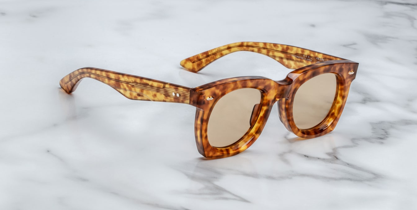 Sleek '50s inspired glasses with graceful lines, signature double-arrowhead front pins, and custom double-laminated temples with refined 'Lever' wire core. Limited edition of 250 pieces. Handcrafted in Japan. Size 45/24. 