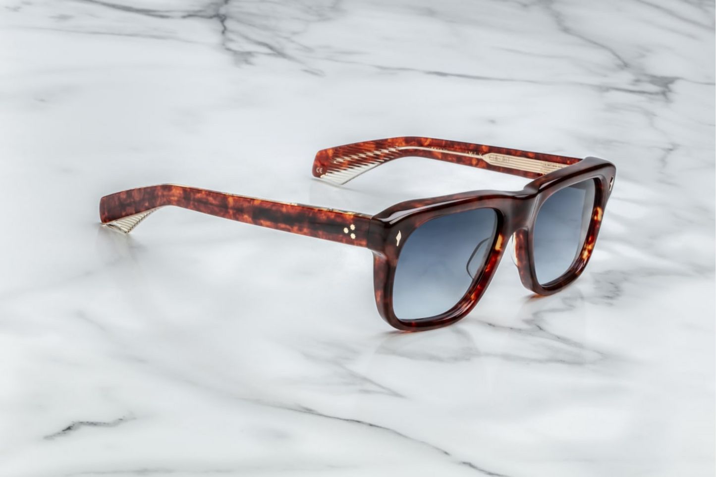 Inspired by Yves Saint Laurent, a French fashion designer. These are classic rectangular glasses with soft angles and notable volumes. 10mm block, polished brown acetate frame, Denim Gradient CR39. Handcrafted in Japan. Limited production of 250. Size 56/19. 