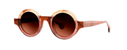 Theo Kubisme eyewear in brown, white, and taupe color scheme, featuring a unique geometric design with a modern, artistic flair.