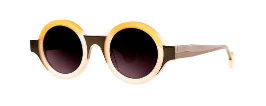 Theo Kubisme eyewear featuring a geometric design with a color palette of grey, green, and orange. The glasses have a unique, artistic frame shape that reflects a modern and bold style.