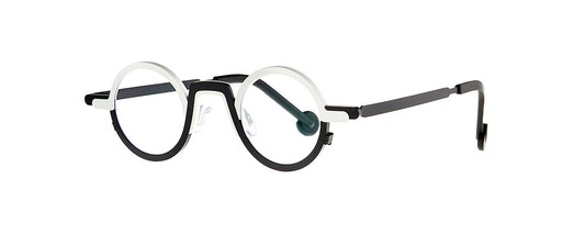 Theo Myeong Dong Black & White eyewear featuring a unique geometric design with a bold black and white color scheme, showcasing a modern and artistic style.