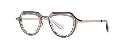 Theo Prong Grey eyewear featuring a unique, modern design with a sleek, angular frame in a neutral grey color, suitable for fashion-forward individuals seeking distinctive and stylish glasses.