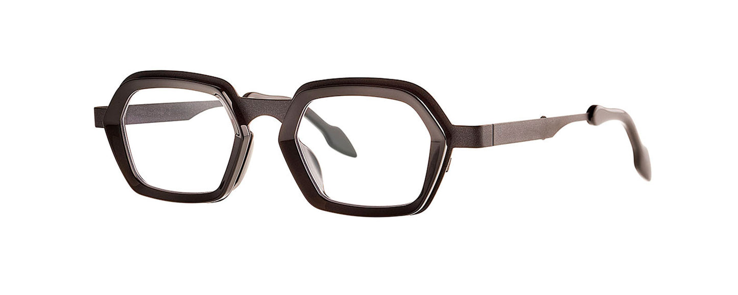 Theo Sky Black eyewear featuring a sleek, modern design with a bold black frame and unique geometric shape, suitable for fashion-forward individuals seeking stylish and distinctive glasses.